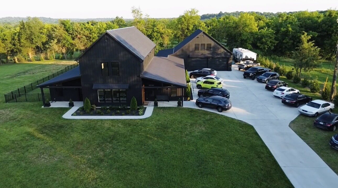 Aerial exterior view of a modern black residence